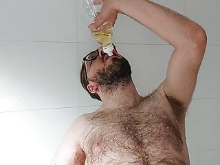 Hairy locked boy plays with piss
