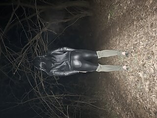 Young sissy in leather night walk forest