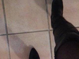 Walking naked wearing high heel boots 