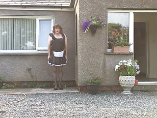 sissy maid neil in his maids uniform outside his house
