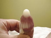A very huge cum shot in a condom.
