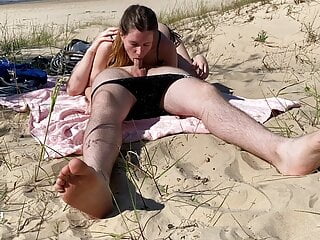 Nudist couple enjoying blowjob beach...