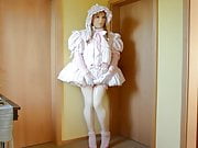 Sissy in frilly pink  little girl style dress.