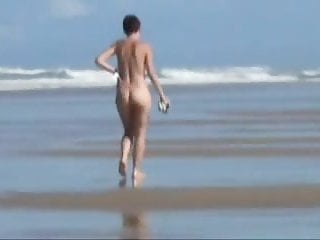 Old girlfriend walking nude on the beach