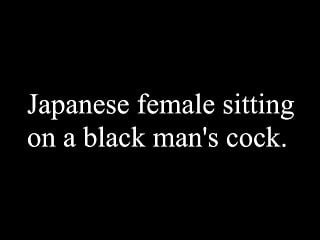 Japanese female sitting on a black...