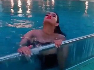 Tattoo girl in swimming pool