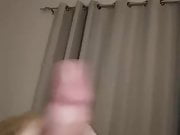 Stroking cock and spilling a load