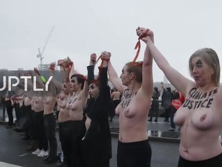 Topless activists block london bridge...