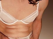 Crossdresser in silky white lingerie (Thlin1070490)