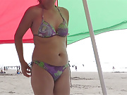 58-year-old Latina MILF shows off on the beach, masturbates