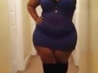 THICK BLACK WOMAN SHOWING OFF DRESS