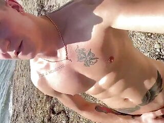 Im sunbathing naked in oil on the city beach