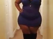 THICK BLACK WOMAN SHOWING OFF DRESS