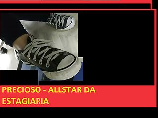 Sneakers worn by the young woman.