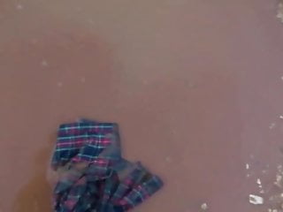 red tartan skirt in mud puddles