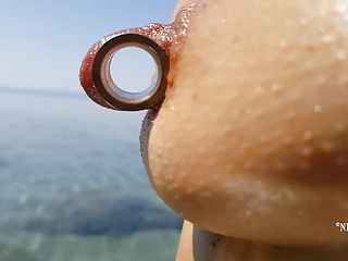 nippleringlover - horny milf pissing on the nude beach, pierced pussy, wide open, huge pierced nipples