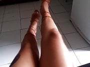 Very feminine strappy sandals wrapped around nice legs.