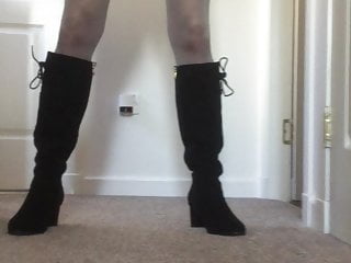Walking in knee high boots and flashing