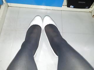 White patent pumps with grey pantyhose...