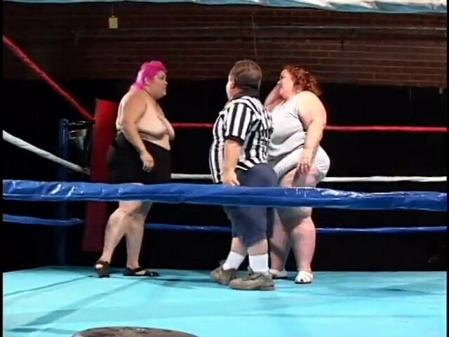 Fat midget girl is shoving a dildo in lesbian midget's pussy