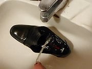 Piss in men's dress shoe