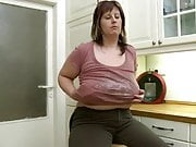 chubby mom shows her body in kitchen