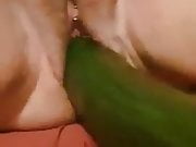 Milf fucked with a huge cucumber