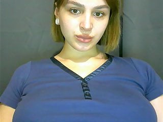 .A pregnant girl gets naked and caresses her pussy.